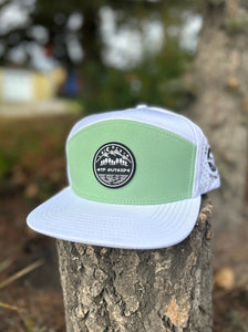 hat flat brim 5 panel, white with mind green front panel and silicone patch with mountain scene logo. Be Bold embroidery logo on the side, GTF Outside embroidered on the back