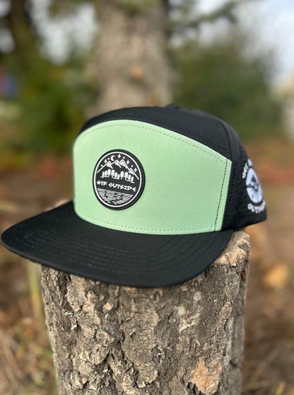 hat flat brim 5 panel, black with mind green front panel and silicone patch with mountain scene logo. Be Bold embroidery logo on the side, GTF Outside embroidered on the back