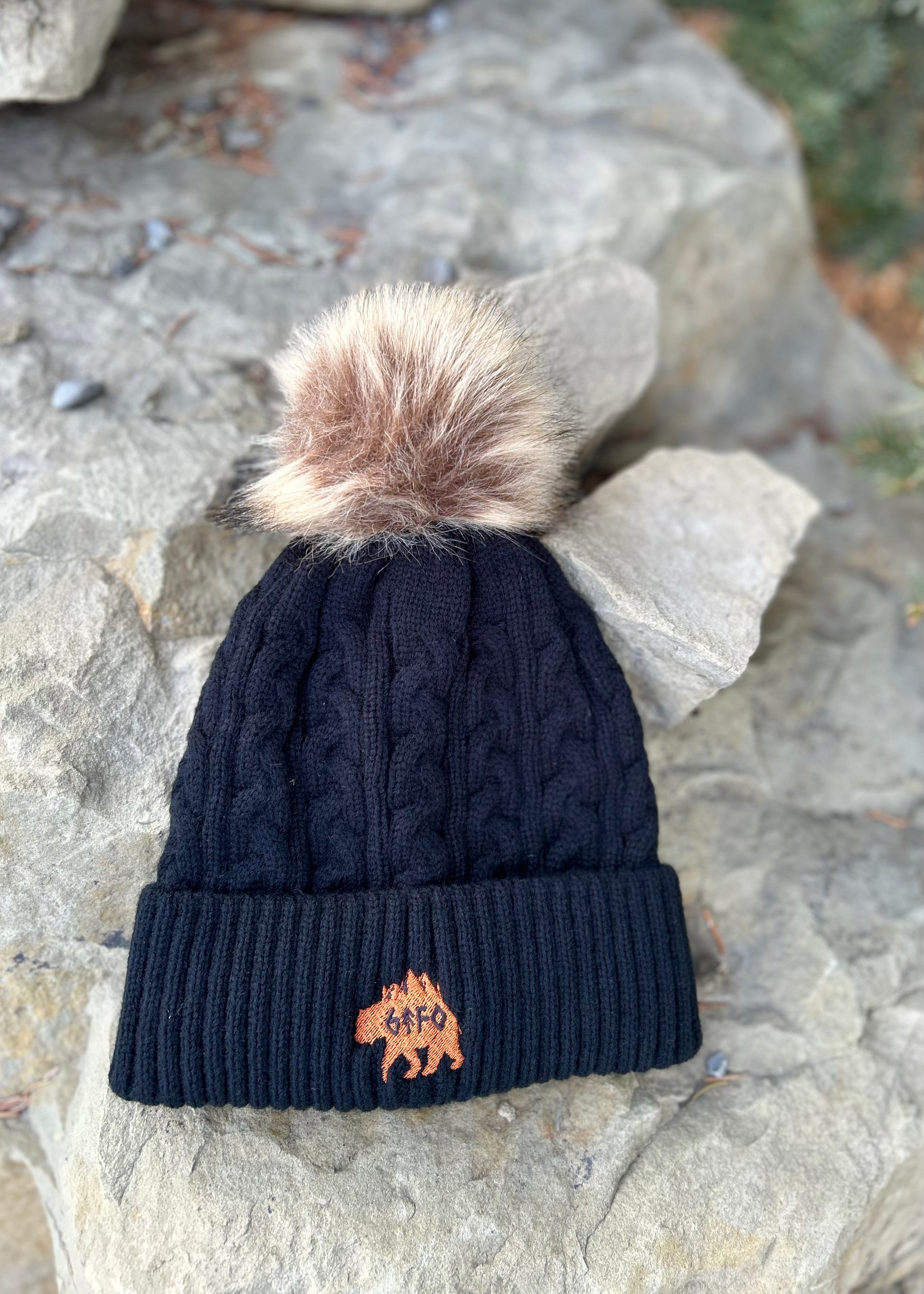 black pom pom toque with grizzly logo. gtf outside. gtfo