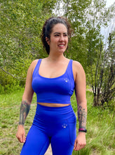 Load image into Gallery viewer, vibrant blue sports bra top and leggings with pockets and no front seam. gtfo. gtf outside. ladies athletic wear
