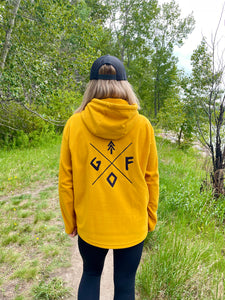 mustard yellow unisex fleece hoodie with black embroidered gtfo logo. gtf outside. ladies. men. hoodie.