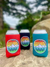 Load image into Gallery viewer, tangerine, black and teal drink koozies. gtf outside. sunrise logo with sun, trees and mountains. 
