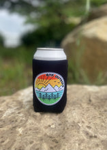 Load image into Gallery viewer, black koozie with gtf outside logo. gtfo. sunrise logo with sun, mountains and trees
