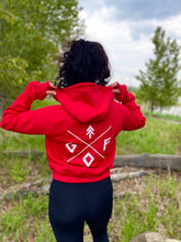 Load image into Gallery viewer, ladies red crop hoodie with white gtfo logo. gtf outside. fingerholes
