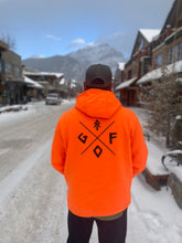 Load image into Gallery viewer, bright orange unisex hoodie with black gtfo logo. gtf outside. ladies. men.
