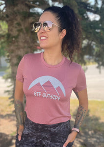mauve ladies crop top. crop shirt. gtf outside. logo with sun and mountains.